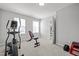 Home gym with workout equipment, natural light from two windows at 350 Arlie Ln, Lillington, NC 27546