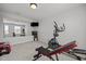 Exercise room with equipment, mirror, and a wall-mounted television at 350 Arlie Ln, Lillington, NC 27546