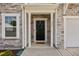 The front door is black and has the house number on the siding at 350 Arlie Ln, Lillington, NC 27546
