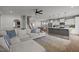 Open-concept living space with a kitchen, dining area, and cozy fireplace, all connected for easy living at 350 Arlie Ln, Lillington, NC 27546
