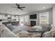 Open-concept living space with a kitchen, dining area, and cozy fireplace, all connected for easy living at 350 Arlie Ln, Lillington, NC 27546