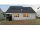 Backyard view with a screened porch and solar panels at 363 Grey Hawk Dr, Garner, NC 27529
