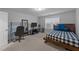 Bedroom with a full sized bed, desk, and carpet flooring at 363 Grey Hawk Dr, Garner, NC 27529