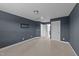 Empty bedroom features neutral carpet, two doors, and a large window for ample natural light at 363 Grey Hawk Dr, Garner, NC 27529