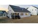 Home exterior with solar panels and screened in porch at 363 Grey Hawk Dr, Garner, NC 27529
