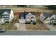 Charming two-story home with a covered front porch, a two-car garage, and well-maintained landscaping at 363 Grey Hawk Dr, Garner, NC 27529