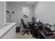 Comfortable home office with a large window, desk, office chair, and printer at 363 Grey Hawk Dr, Garner, NC 27529