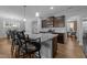 Spacious kitchen island with bar stool seating, stainless appliances, and contemporary finishes create a perfect space at 363 Grey Hawk Dr, Garner, NC 27529