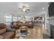 Inviting living room with a fireplace, comfortable seating, and a seamless transition into the modern kitchen at 363 Grey Hawk Dr, Garner, NC 27529