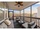 Relaxing screened porch with comfortable seating and ceiling fan at 363 Grey Hawk Dr, Garner, NC 27529