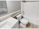 Bathroom features a white vanity, tile flooring, and a bathtub with shower at 4023 Cashew Dr, Raleigh, NC 27616