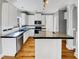 Well-lit kitchen featuring white cabinetry and sleek countertops at 4023 Cashew Dr, Raleigh, NC 27616