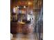 A full view of a bathroom with dual vessel sinks, granite counters, and a glass shower enclosure at 410 W Barrington St, Dunn, NC 28334