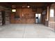 Covered patio area with an outdoor kitchen, stainless steel appliances, and concrete flooring at 410 W Barrington St, Dunn, NC 28334