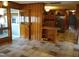 View of a kitchen area with wood-paneled walls and wooden cabinetry at 410 W Barrington St, Dunn, NC 28334