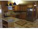 Cozy kitchen featuring custom wooden cabinetry and stainless steel appliances at 410 W Barrington St, Dunn, NC 28334