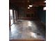 Living Room with brick fireplace, slate flooring, ceiling fans, and access to an outdoor patio at 410 W Barrington St, Dunn, NC 28334