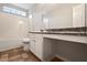 Bathroom featuring a combination shower and bathtub, single sink vanity, and tile flooring at 4201 Hampstead Village Dr, Durham, NC 27703