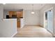 Bright dining area features wood floors, a pendant light and sliding glass door access to the backyard at 4201 Hampstead Village Dr, Durham, NC 27703