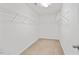 Walk-in closet with carpeted floor and wire shelving for storage at 4201 Hampstead Village Dr, Durham, NC 27703
