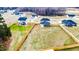 Aerial view of a home with a spacious fenced backyard and landscaped surroundings at 430 St. Claire Dr, Fuquay Varina, NC 27526