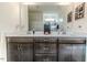 Bathroom vanity with dual sinks, quartz countertops, and a large mirror reflecting the shower area at 430 St. Claire Dr, Fuquay Varina, NC 27526