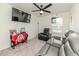Cozy bedroom features a ceiling fan, television, seating and carpeted floor at 430 St. Claire Dr, Fuquay Varina, NC 27526
