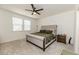 Cozy bedroom featuring a plush bed, neutral colors, and ample natural light at 430 St. Claire Dr, Fuquay Varina, NC 27526