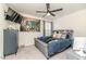 Bedroom with a plush bed, modern decor, and a mounted TV, creating a cozy and inviting space at 430 St. Claire Dr, Fuquay Varina, NC 27526