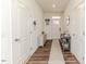 Clean hallway with wood floors, leading to the home's entrance at 430 St. Claire Dr, Fuquay Varina, NC 27526