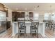 Kitchen island with seating, stainless steel appliances, and dark cabinets at 430 St. Claire Dr, Fuquay Varina, NC 27526