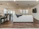 Bright living room with wood floors, a view of the backyard, and a modern sectional sofa at 430 St. Claire Dr, Fuquay Varina, NC 27526