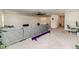 Open living space featuring a large sectional sofa, ceiling fan, and access to other areas of the home at 430 St. Claire Dr, Fuquay Varina, NC 27526
