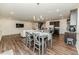 Open floor plan showcasing kitchen island, dining area, and living room with modern decor at 430 St. Claire Dr, Fuquay Varina, NC 27526