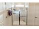 Modern bathroom featuring a glass enclosed shower with tiled walls and a small transom window at 430 St. Claire Dr, Fuquay Varina, NC 27526