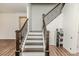 Elegant staircase with wood and metal railing, connecting to the main living area at 430 St. Claire Dr, Fuquay Varina, NC 27526