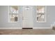 Bright entryway with natural light, showcasing the front door and adjacent windows at 521 Eastway Ave # Apt B, Durham, NC 27703