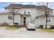 Rear exterior of home featuring a rear entrance, car in driveway, and AC unit at 521 Eastway Ave # Apt B, Durham, NC 27703