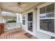 Close-up of cozy front porch featuring a swing, ceiling fan, and a welcoming 'Home Sweet Home' mat at 521 Eastway Ave # Apt B, Durham, NC 27703