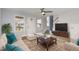 Inviting living room with a ceiling fan, rug, large television, and ample seating at 521 Eastway Ave # Apt B, Durham, NC 27703