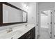 Bright bathroom features double sinks, framed mirror, and walk-in shower with white subway tile at 5609 Abbey Grace Ln, Wake Forest, NC 27587