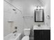 Bathroom featuring subway tiles, a shower-tub, and a modern vanity at 5609 Abbey Grace Ln, Wake Forest, NC 27587