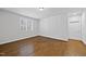 Light-filled bedroom offering hardwood floors, shutters, and neutral paint at 5609 Abbey Grace Ln, Wake Forest, NC 27587