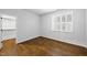 Neutral bedroom with hardwood floors, plantation shutters, and a closet at 5609 Abbey Grace Ln, Wake Forest, NC 27587