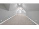 Large bonus room offering ample space and natural light, with built-in shelving at 5609 Abbey Grace Ln, Wake Forest, NC 27587