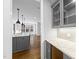 Stylish kitchen with gray cabinets, granite countertops, and stainless steel appliances at 5609 Abbey Grace Ln, Wake Forest, NC 27587