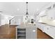 Modern kitchen with large island, granite counters, stainless appliances and open layout at 5609 Abbey Grace Ln, Wake Forest, NC 27587