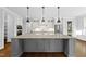 Spacious kitchen island with granite countertop and modern pendant lighting at 5609 Abbey Grace Ln, Wake Forest, NC 27587