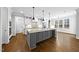 Gourmet kitchen featuring a large center island and abundant cabinet space at 5609 Abbey Grace Ln, Wake Forest, NC 27587