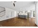Open concept living space with hardwood floors, recessed lighting, island kitchen, and stairs to the second floor at 5609 Abbey Grace Ln, Wake Forest, NC 27587